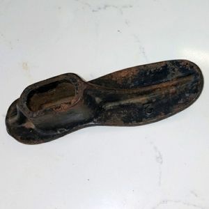 Vintage shoe mold/stretcher from 1900s. Has size 2 on side. Cast iron, metal